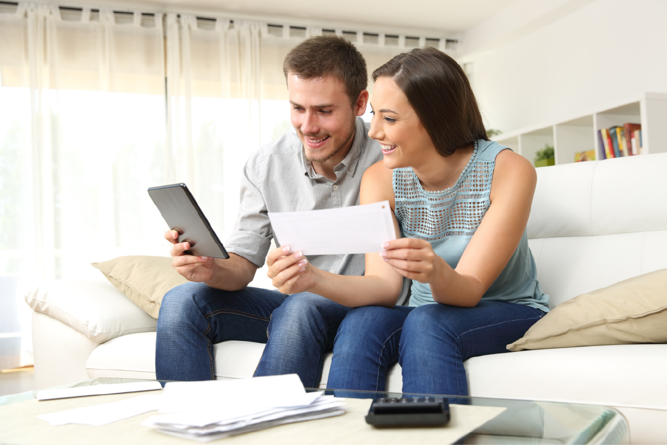 happy couple checking bank account