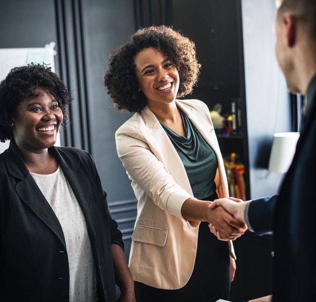 woman shaking hands