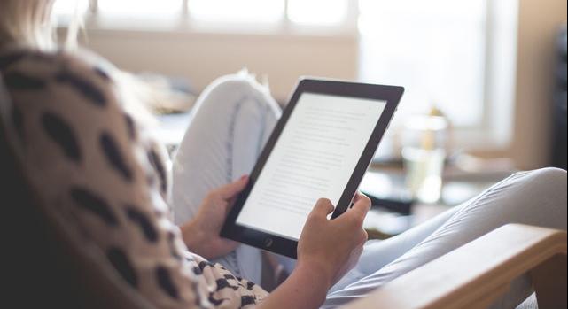 woman reading tablet